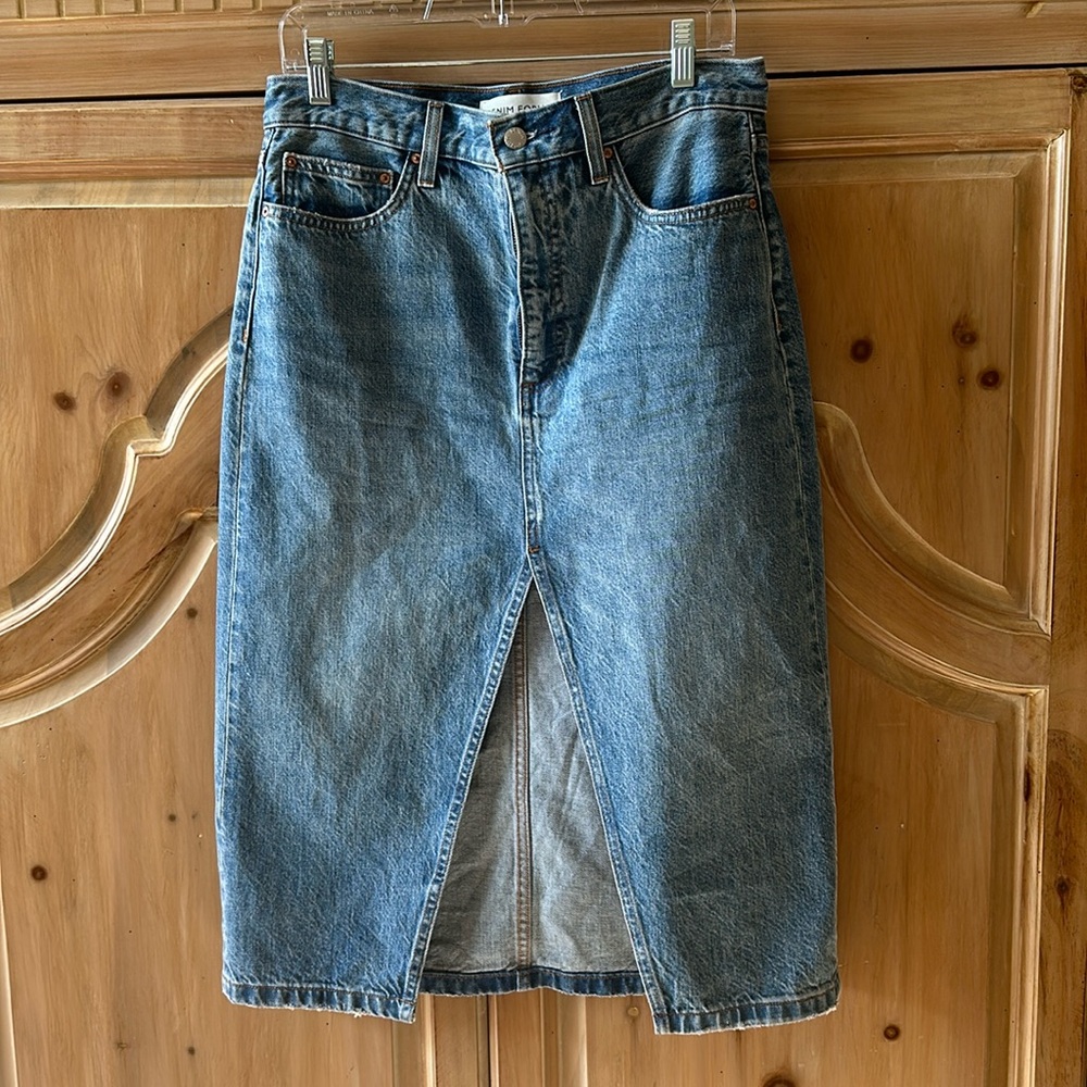 Denim skirt, new without tags from Aritzia, size 29.  Falls below the knee